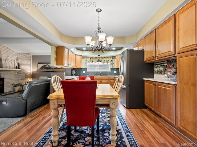 7363 Provincial Rd, Canton, MI 48187 - dining room with light wood-style flooring and a chandelier