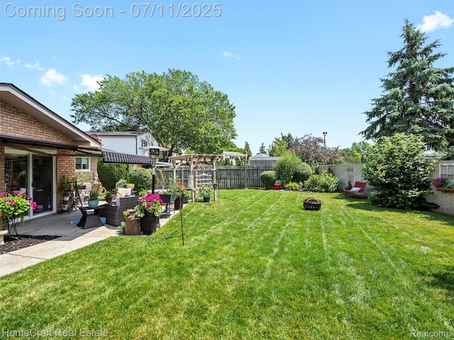 7363 Provincial Rd, Canton, MI 48187 - fenced backyard with an outdoor living space with a fire pit and a patio area