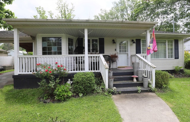 1052 E Rowland St, Grand Blanc, MI 48507 - view of front of house with a front yard and covered porch