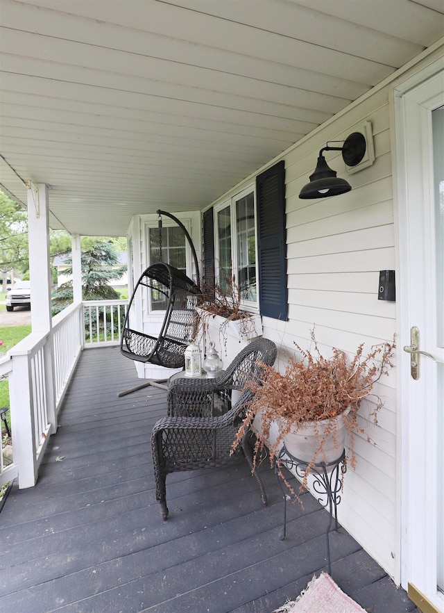 1052 E Rowland St, Grand Blanc, MI 48507 - wooden porch with a carport