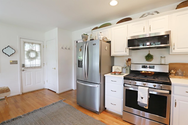 1052 E Rowland St, Grand Blanc, MI 48507 - kitchen with appliances with stainless steel finishes, light wood-style floors, white cabinetry, and light countertops