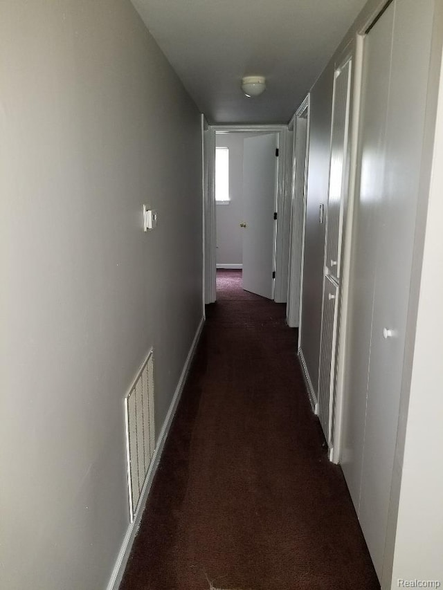 203 W Columbia Ave, Troy, MI 48340 - hall with dark colored carpet and baseboards