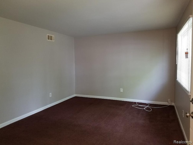 203 W Columbia Ave, Troy, MI 48340 - spare room with dark carpet and baseboards