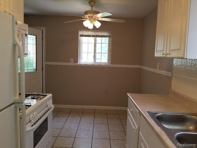 203 W Columbia Ave, Troy, MI 48340 - kitchen with white appliances, a wainscoted wall, ceiling fan, white cabinets, and light countertops