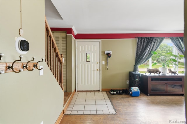 927 Piper Dr, Saginaw, MI 48604 - foyer entrance with light wood-style floors and stairway