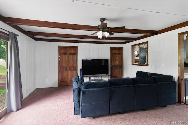 927 Piper Dr, Saginaw, MI 48604 - living room with beam ceiling, carpet, a ceiling fan, and wood walls