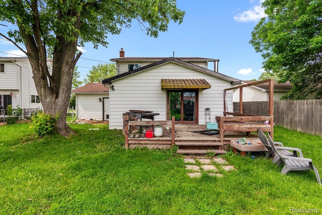 927 Piper Dr, Saginaw, MI 48604 - rear view of house with a wooden deck and a chimney