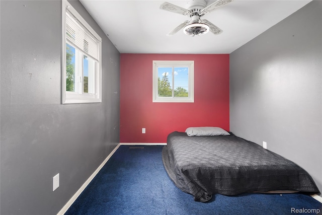 927 Piper Dr, Saginaw, MI 48604 - carpeted bedroom with baseboards and a ceiling fan