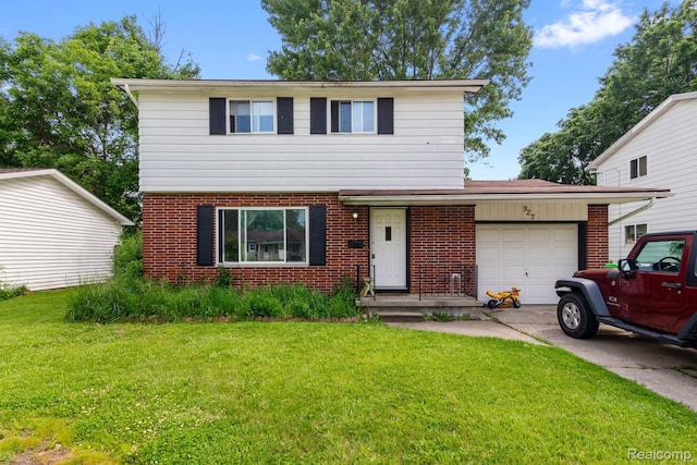 927 Piper Dr, Saginaw, MI 48604 - colonial home with brick siding, an attached garage, a front yard, and concrete driveway