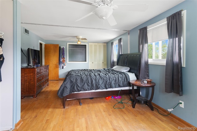 927 Piper Dr, Saginaw, MI 48604 - bedroom featuring wood finished floors, a closet, and a ceiling fan
