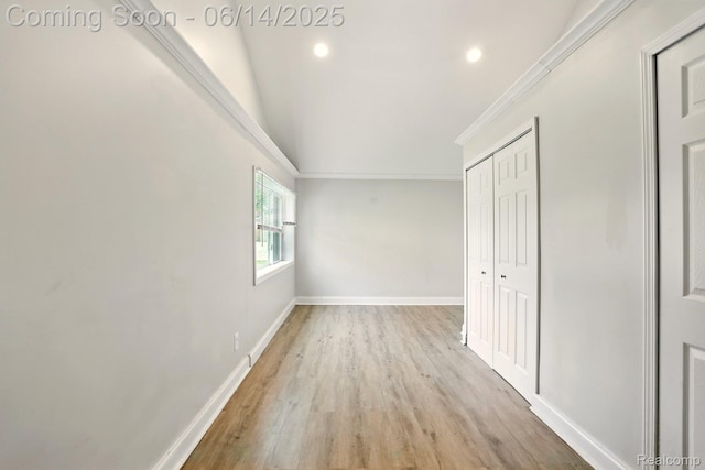 2121 Chesley Dr, Sterling Heights, MI 48310 - unfurnished bedroom with light wood-type flooring, ornamental molding, recessed lighting, and a closet