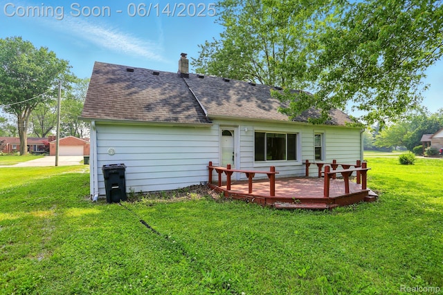 2121 Chesley Dr, Sterling Heights, MI 48310 - rear view of house with a deck, a shingled roof, and a lawn