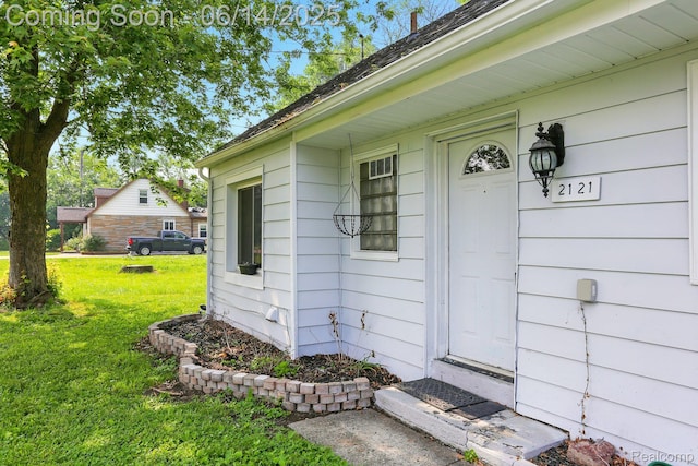 2121 Chesley Dr, Sterling Heights, MI 48310 - doorway to property with a yard