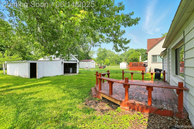 2121 Chesley Dr, Sterling Heights, MI 48310 - view of grassy yard with an outdoor structure and a wooden deck
