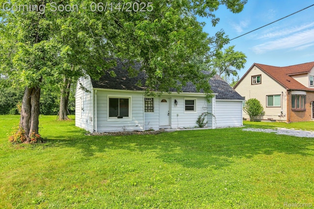 2121 Chesley Dr, Sterling Heights, MI 48310 - view of front of property with a front yard and a shingled roof