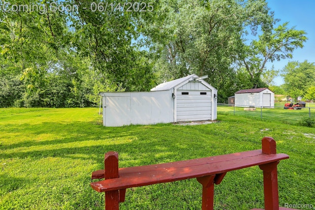 2121 Chesley Dr, Sterling Heights, MI 48310 - view of yard featuring a storage unit