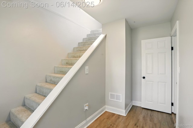 2121 Chesley Dr, Sterling Heights, MI 48310 - stairway featuring wood finished floors and baseboards
