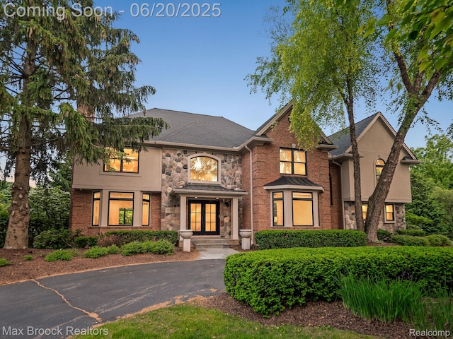 4331 Spruce Hill Ln, Birmingham, MI 48301 - view of front of home featuring stone siding, stucco siding, and french doors