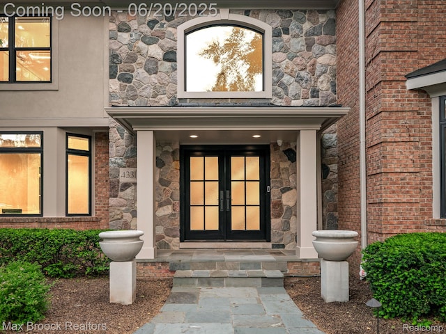 4331 Spruce Hill Ln, Birmingham, MI 48301 - doorway to property with stone siding and french doors