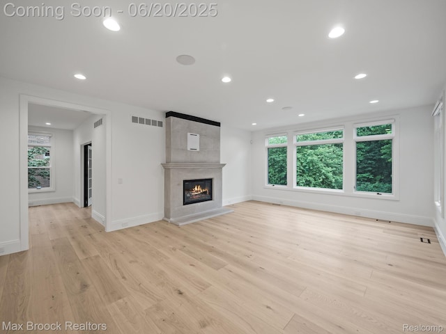 4331 Spruce Hill Ln, Birmingham, MI 48301 - unfurnished living room with light wood-style floors, recessed lighting, and a large fireplace