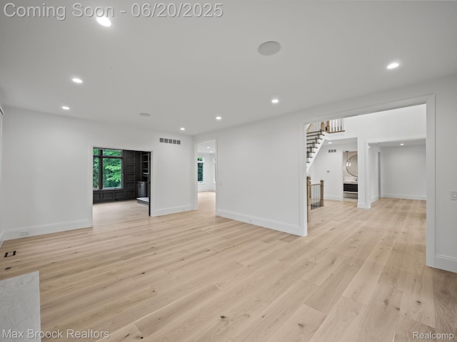 4331 Spruce Hill Ln, Birmingham, MI 48301 - empty room featuring light wood-style floors, recessed lighting, and stairs