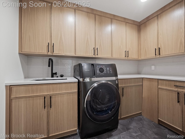 4331 Spruce Hill Ln, Birmingham, MI 48301 - washroom featuring washer / clothes dryer, cabinet space, and dark tile patterned floors