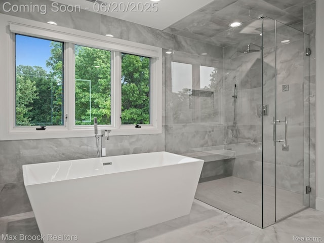 4331 Spruce Hill Ln, Birmingham, MI 48301 - full bath with marble finish floors, a soaking tub, tile walls, and a shower stall