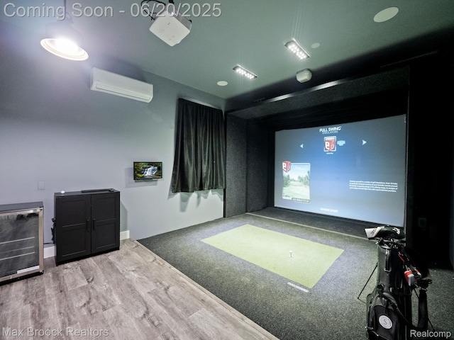 4331 Spruce Hill Ln, Birmingham, MI 48301 - recreation room featuring golf simulator, a wall unit AC, and wood finished floors