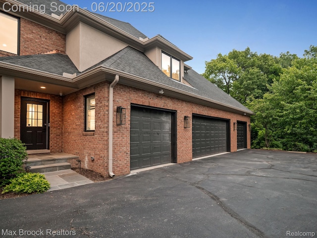 4331 Spruce Hill Ln, Birmingham, MI 48301 - view of side of home with brick siding, asphalt driveway, and roof with shingles