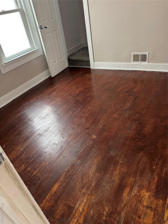 7821 Mead St, Dearborn, MI 48126 - empty room with dark wood-type flooring and baseboards