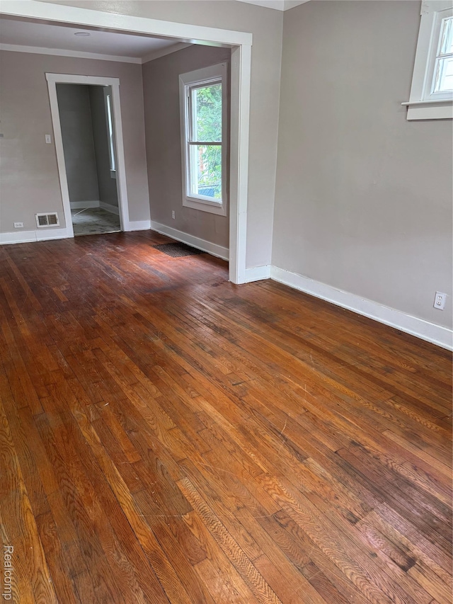 7821 Mead St, Dearborn, MI 48126 - unfurnished room featuring dark wood-type flooring and crown molding