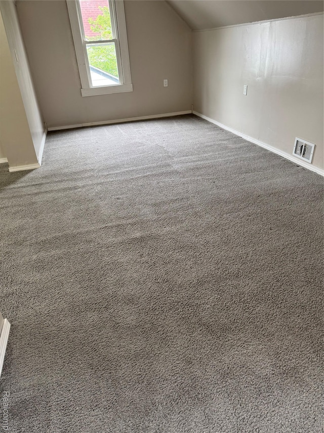 7821 Mead St, Dearborn, MI 48126 - additional living space featuring vaulted ceiling and carpet