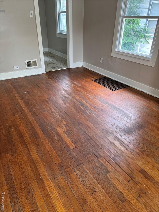 7821 Mead St, Dearborn, MI 48126 - spare room with dark wood-style floors and baseboards