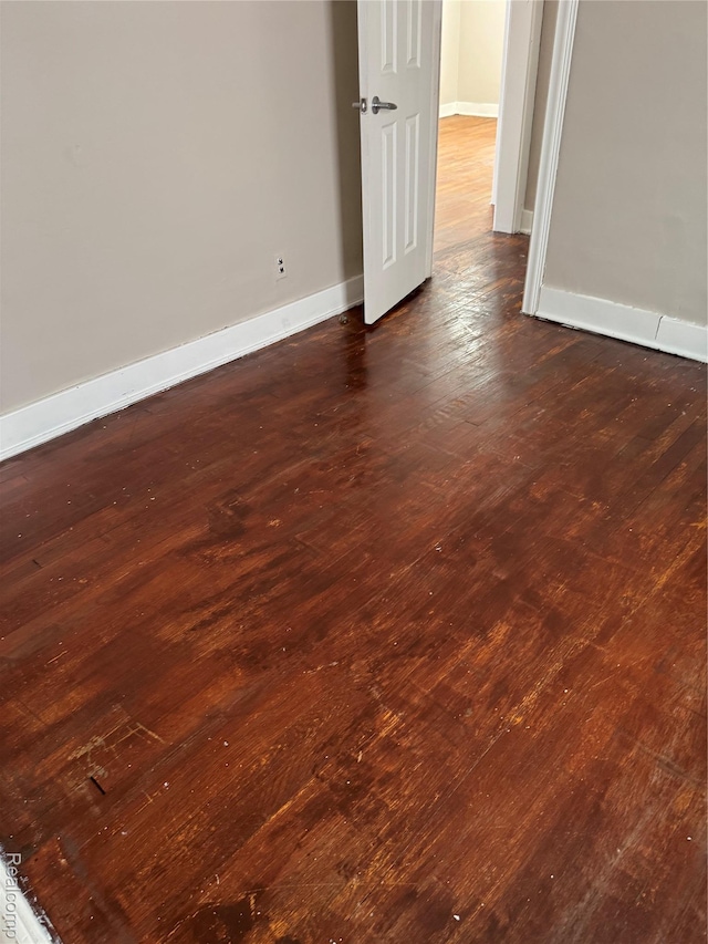 7821 Mead St, Dearborn, MI 48126 - unfurnished room with baseboards and dark wood-style floors