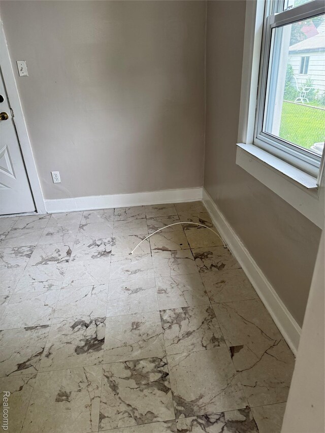 7821 Mead St, Dearborn, MI 48126 - spare room with baseboards and marble look tile flooring