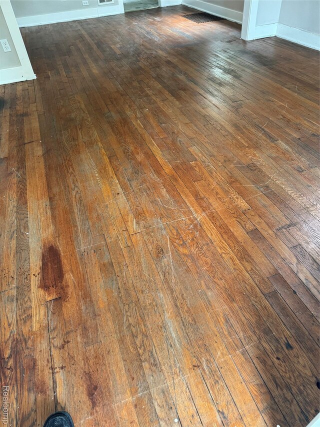 7821 Mead St, Dearborn, MI 48126 - detailed view of wood finished floors and baseboards