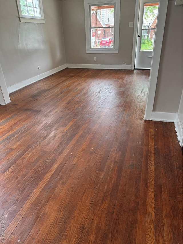 7821 Mead St, Dearborn, MI 48126 - empty room featuring dark wood-style flooring and baseboards