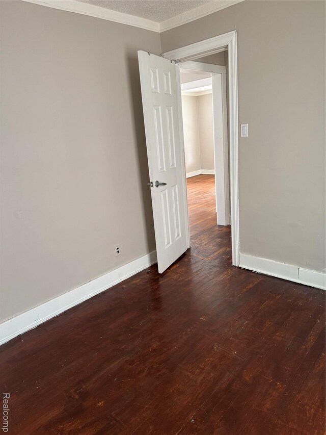 7821 Mead St, Dearborn, MI 48126 - empty room with ornamental molding and dark wood-style floors