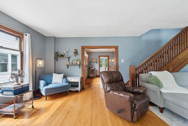 238 E E Main St, Milan, MI 48160 - living area featuring light wood-style floors and stairs