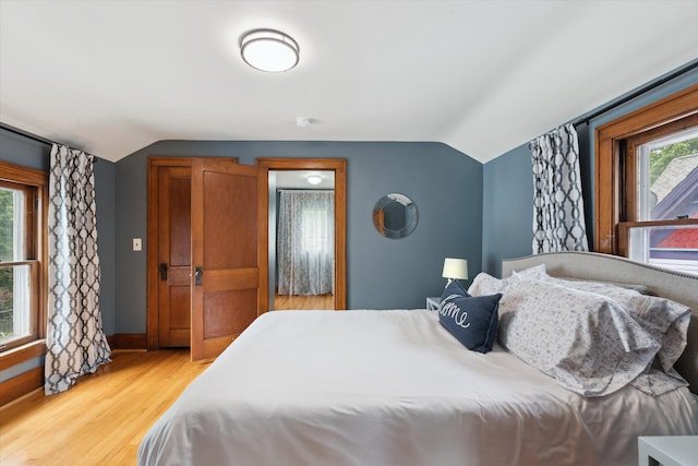 238 E E Main St, Milan, MI 48160 - bedroom featuring vaulted ceiling and light wood-style flooring