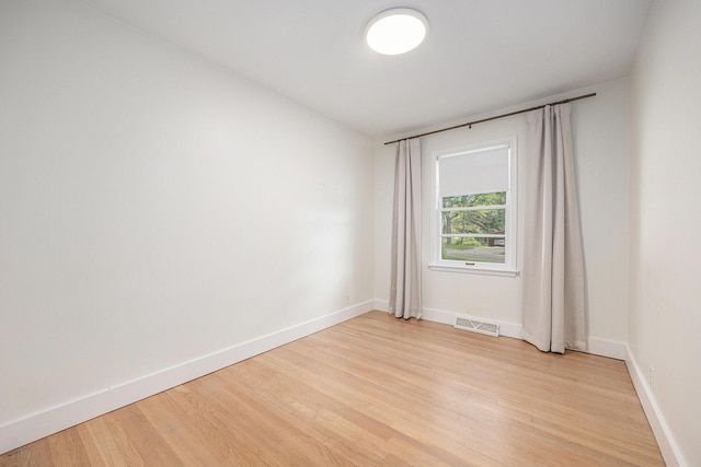 1102 Spencer St NE, Grand Rapids, MI 49505 - spare room with light wood finished floors and baseboards