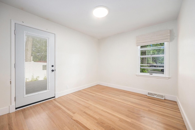 1102 Spencer St NE, Grand Rapids, MI 49505 - empty room with wood finished floors