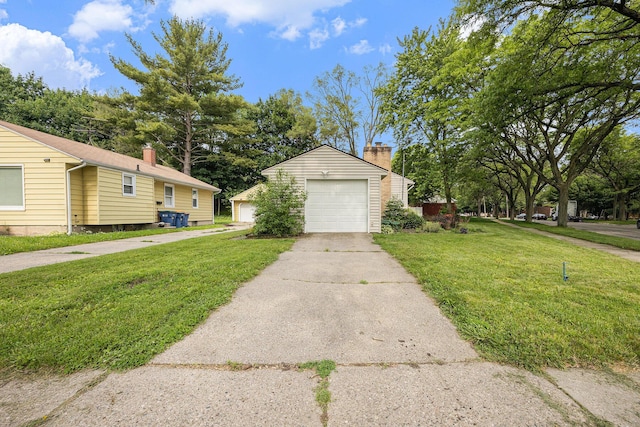 1102 Spencer St NE, Grand Rapids, MI 49505 - view of front of property with an outdoor structure, a garage, a front lawn, a chimney, and driveway