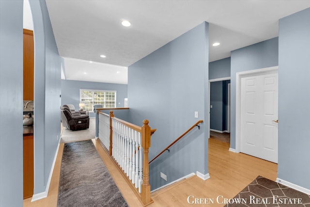 5173 Olsen Springs Ct Unit 13, Wyoming, MI 49509 - hall featuring an upstairs landing, light wood-style flooring, and recessed lighting