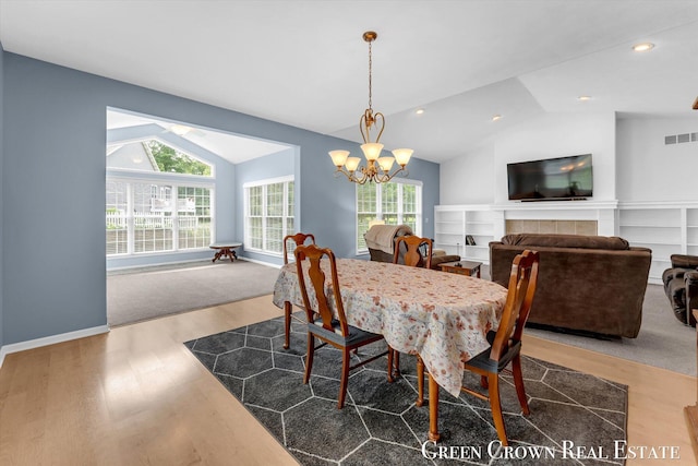 5173 Olsen Springs Ct Unit 13, Wyoming, MI 49509 - dining space featuring vaulted ceiling, a chandelier, wood finished floors, and recessed lighting