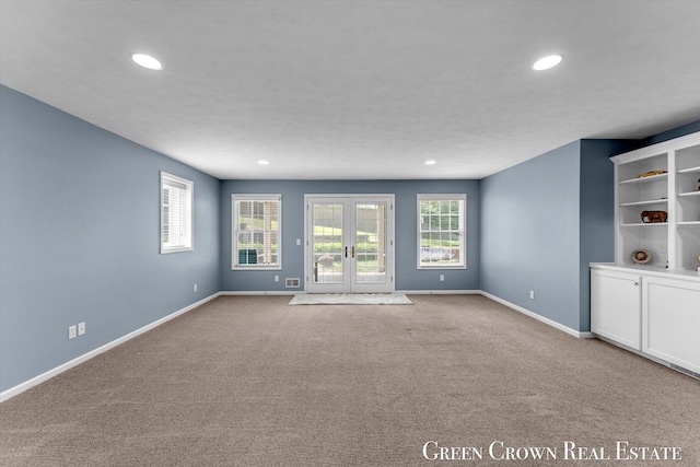 5173 Olsen Springs Ct Unit 13, Wyoming, MI 49509 - spare room with carpet flooring, recessed lighting, and french doors