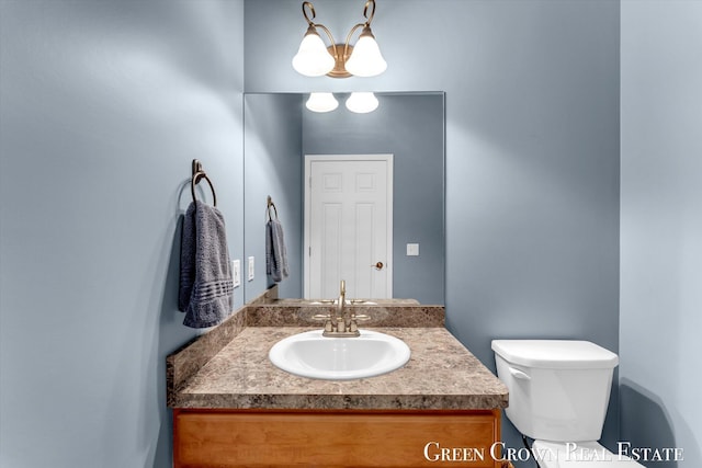 5173 Olsen Springs Ct Unit 13, Wyoming, MI 49509 - half bathroom featuring vanity and toilet