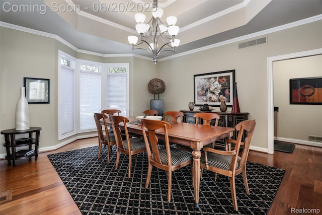 5007 Rockaway Ln, Clarkston, MI 48348 - dining room with a raised ceiling, a chandelier, wood finished floors, and ornamental molding
