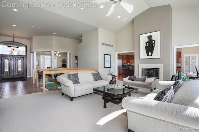 5007 Rockaway Ln, Clarkston, MI 48348 - living area with high vaulted ceiling, ornate columns, a ceiling fan, recessed lighting, and dark tile patterned flooring