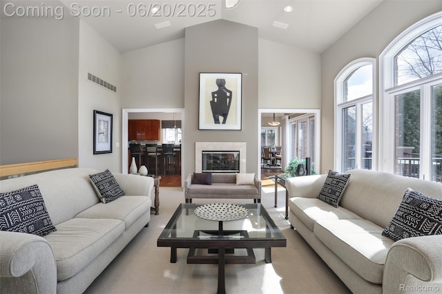 5007 Rockaway Ln, Clarkston, MI 48348 - living area with high vaulted ceiling and a glass covered fireplace